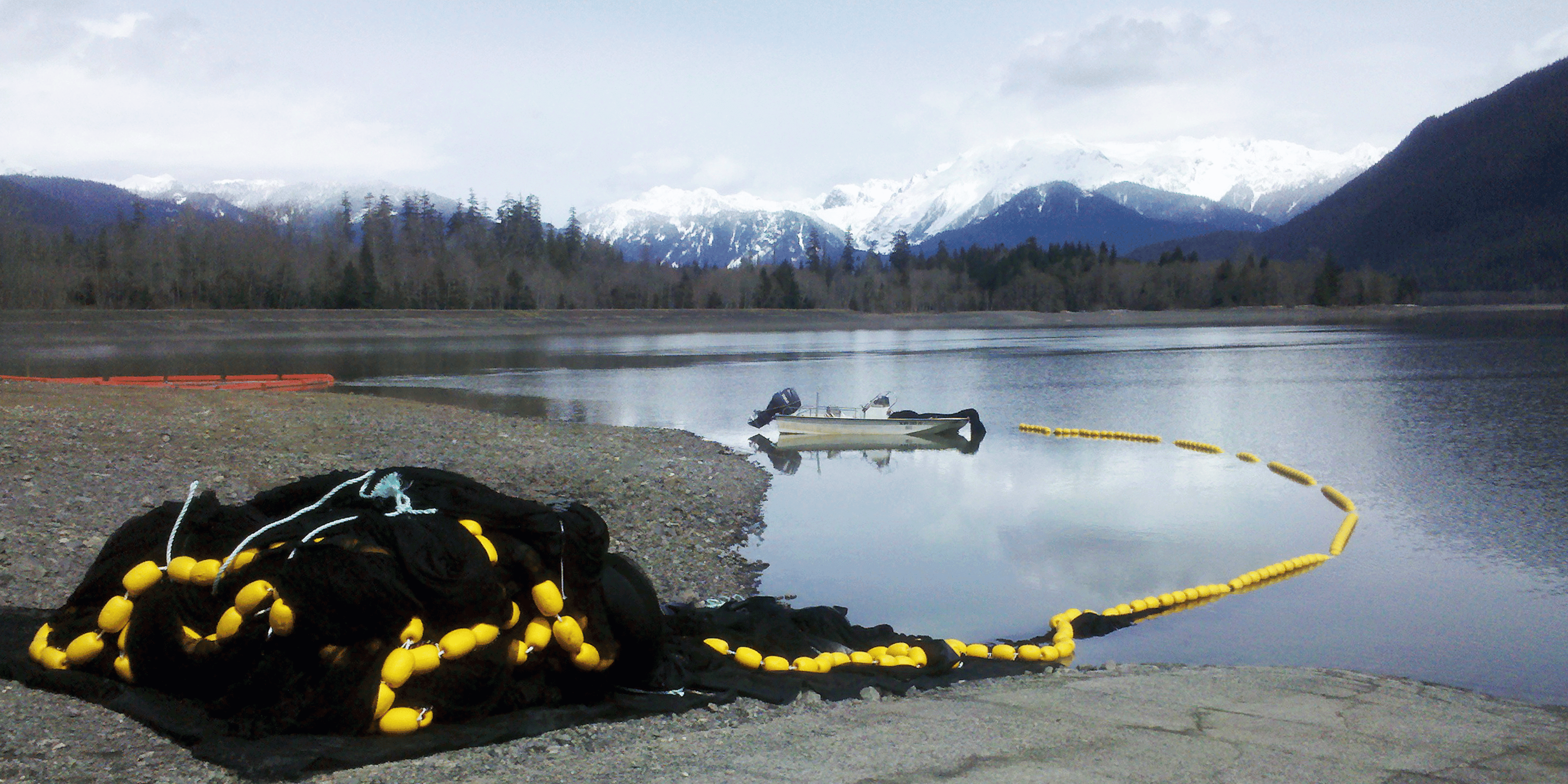 Custom seine netting being used to catch fish in a lake with boat