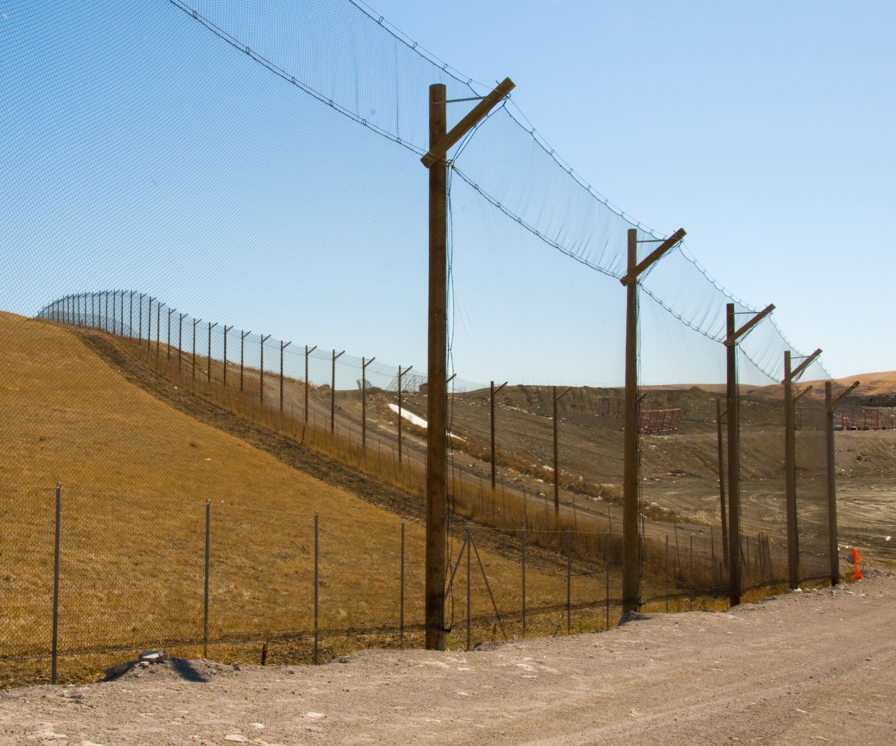 custom net designed to keep debris and trash in landfill area