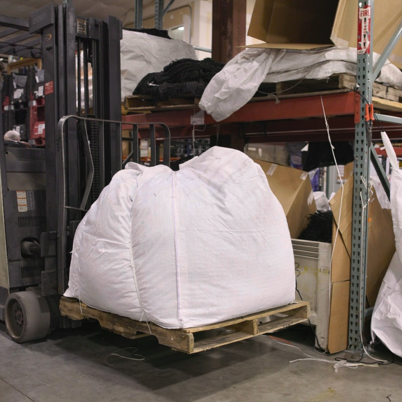 Forklift moving custom netting to be shipped to a customer